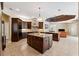 Open kitchen with large island and breakfast bar at 20200 Lace Cascade Rd, Land O Lakes, FL 34637