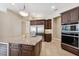 Modern kitchen with stainless steel appliances and a large island with seating at 20200 Lace Cascade Rd, Land O Lakes, FL 34637