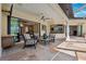 Covered patio with seating area and views of the pool at 20200 Lace Cascade Rd, Land O Lakes, FL 34637