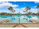 Community pool with a waterslide and surrounding lounge area at 20200 Lace Cascade Rd, Land O Lakes, FL 34637