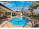 Inviting screened pool area with outdoor kitchen and seating at 20200 Lace Cascade Rd, Land O Lakes, FL 34637