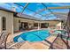 Large screened pool, spa, and outdoor kitchen area at 20200 Lace Cascade Rd, Land O Lakes, FL 34637