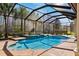 Relaxing screened pool and spa with outdoor seating at 20200 Lace Cascade Rd, Land O Lakes, FL 34637