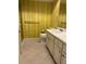 Bathroom featuring sink with cabinets, commode, and sliding glass door shower at 2718 Highlands Blvd # A, Palm Harbor, FL 34684