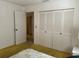 Bedroom featuring closet and a glimpse of doorway leading into an adjacent room at 2718 Highlands Blvd # A, Palm Harbor, FL 34684