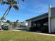 Exterior view of the community pool with the pool-side chairs in the background at 2718 Highlands Blvd # A, Palm Harbor, FL 34684