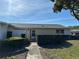 Charming single-story home featuring well-maintained landscaping and a welcoming front entrance at 2718 Highlands Blvd # A, Palm Harbor, FL 34684