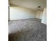 Spacious living room featuring neutral carpet and ample natural light, creating an inviting atmosphere at 2718 Highlands Blvd # A, Palm Harbor, FL 34684