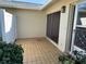 Tiled outdoor patio area providing space for relaxation and entertaining, accessed by sliding doors at 2718 Highlands Blvd # A, Palm Harbor, FL 34684