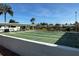 Enjoy the community shuffleboard courts near the pond on a sunny day at 2718 Highlands Blvd # A, Palm Harbor, FL 34684