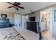 King-size bed in spacious bedroom with ceiling fan and en-suite bathroom at 3308 Oleander Dr, Hernando Beach, FL 34607
