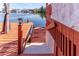 Steps leading down to the water from a wooden deck at 3308 Oleander Dr, Hernando Beach, FL 34607