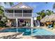Two-story home with screened porch, pool and patio at 3308 Oleander Dr, Hernando Beach, FL 34607