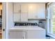 Laundry room featuring new washer and dryer, and cabinets at 3308 Oleander Dr, Hernando Beach, FL 34607