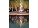 Inviting poolside area with a unique light sculpture and tranquil setting at 3308 Oleander Dr, Hernando Beach, FL 34607
