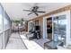 Relaxing screened porch with outdoor furniture at 3308 Oleander Dr, Hernando Beach, FL 34607