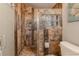 Tiled shower showcasing decorative accents, multiple shower heads, and glass block window at 3308 Oleander Dr, Hernando Beach, FL 34607