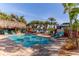 Sparkling, refreshing pool with a tiki hut and lounge chairs at 3308 Oleander Dr, Hernando Beach, FL 34607