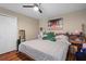 King-size bed, hardwood floors, and large window at 3497 Chadwick Ave, Spring Hill, FL 34609