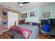 Bedroom with a queen bed and brick feature wall at 3497 Chadwick Ave, Spring Hill, FL 34609