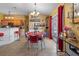 Kitchen with island, wood cabinets, granite countertops, and stainless steel appliances at 3497 Chadwick Ave, Spring Hill, FL 34609