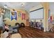 Living room with sectional sofa, projection screen, and Harry Potter decor at 3497 Chadwick Ave, Spring Hill, FL 34609