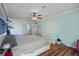 Main bedroom features a king-size bed and ceiling fan at 3497 Chadwick Ave, Spring Hill, FL 34609