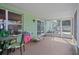 Screened porch with seating and backyard access at 3497 Chadwick Ave, Spring Hill, FL 34609