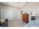 Bedroom with a twin bed, dresser, and leather couch at 3912 Rudder Way, New Port Richey, FL 34652