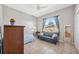 Bedroom with a double bed, leather couch and window seat at 3912 Rudder Way, New Port Richey, FL 34652