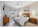 Cozy bedroom with a queen-size bed and wood furniture at 3912 Rudder Way, New Port Richey, FL 34652