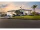 Single-story home with a two-car garage and landscaped lawn at 3912 Rudder Way, New Port Richey, FL 34652