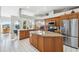Spacious kitchen with island, stainless steel appliances, and ample counter space at 3912 Rudder Way, New Port Richey, FL 34652