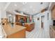 Open kitchen boasts granite countertops, wood cabinets, and an island at 3912 Rudder Way, New Port Richey, FL 34652