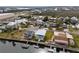 Aerial view of waterfront homes with backyard boat docks and canal access at 4045 Centavo Ct, Hernando Beach, FL 34607