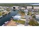 Aerial view of waterfront homes with boat docks and canal access to open water at 4045 Centavo Ct, Hernando Beach, FL 34607