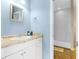 Bathroom featuring a spacious vanity, neutral granite countertop and tile shower at 4045 Centavo Ct, Hernando Beach, FL 34607