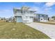 Lovely two-story home with a well-maintained lawn, ample parking, and a welcoming facade at 4045 Centavo Ct, Hernando Beach, FL 34607