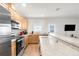 Modern kitchen with stainless steel appliances and a countertop bar that can also be used for dining at 4045 Centavo Ct, Hernando Beach, FL 34607