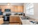Well-equipped kitchen with modern appliances, ample counter space, and wooden cabinets for storage at 4045 Centavo Ct, Hernando Beach, FL 34607