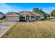 Property features a pool, screened patio, and large backyard at 4061 Montano Ave, Spring Hill, FL 34609
