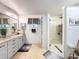 Elegant bathroom with granite countertops, large shower and modern fixtures at 4061 Montano Ave, Spring Hill, FL 34609