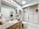 Clean bathroom with shower/tub combo and granite countertop at 4061 Montano Ave, Spring Hill, FL 34609