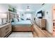 Bright bedroom featuring a king-size bed and built-in dresser at 4061 Montano Ave, Spring Hill, FL 34609