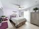 Cozy bedroom with a queen-size bed and lovely decor at 4061 Montano Ave, Spring Hill, FL 34609