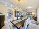 Bright dining room with a large table and access to the living area at 4061 Montano Ave, Spring Hill, FL 34609