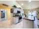 Bright kitchen with stainless steel appliances and island at 4061 Montano Ave, Spring Hill, FL 34609
