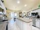 Updated kitchen featuring white cabinets and granite counters at 4061 Montano Ave, Spring Hill, FL 34609