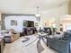 Bright living room with comfortable seating and a large TV at 4061 Montano Ave, Spring Hill, FL 34609