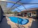 Enjoy this relaxing kidney shaped pool and screened patio at 4061 Montano Ave, Spring Hill, FL 34609